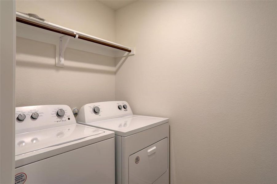 Washroom featuring independent washer and dryer