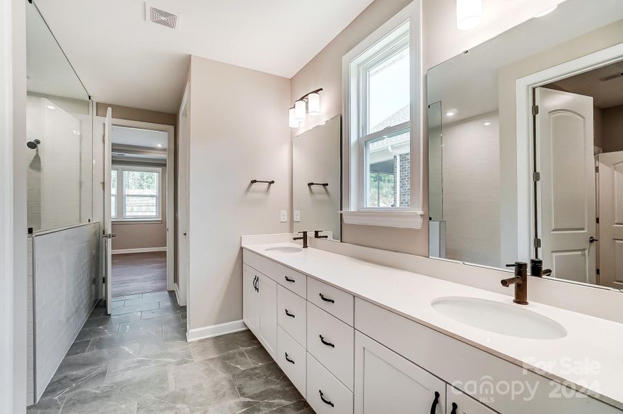 Primary Bathroom with Double Sinks-Photo similar to Subject Property