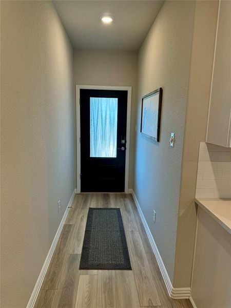 Doorway featuring light hardwood / wood-style flooring