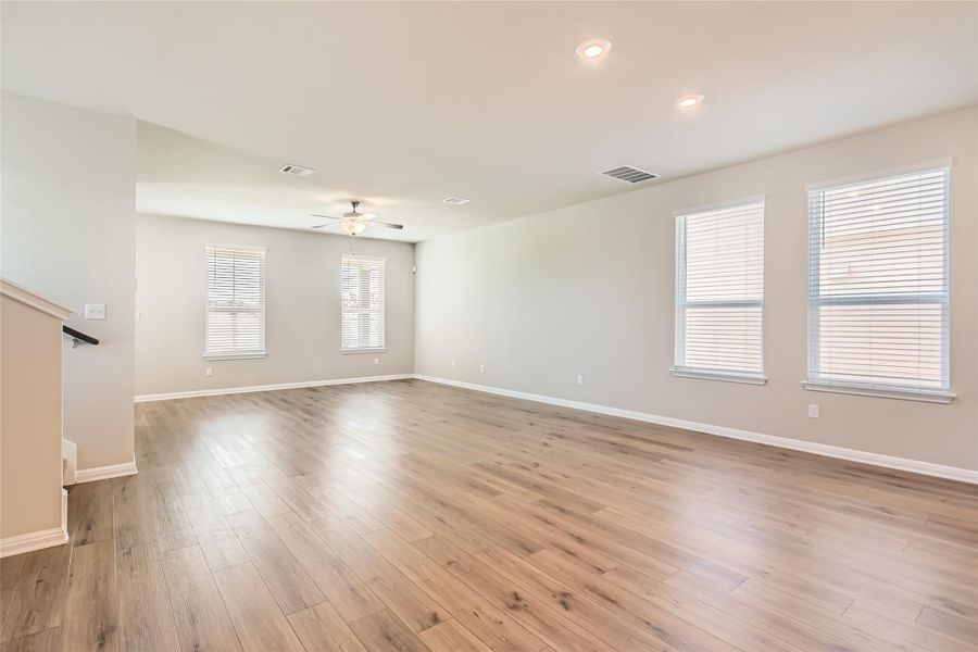 Easy-to-maintain engineered vinyl plank flooring runs throughout the main floor and in the upstairs bathroom and laundry room.