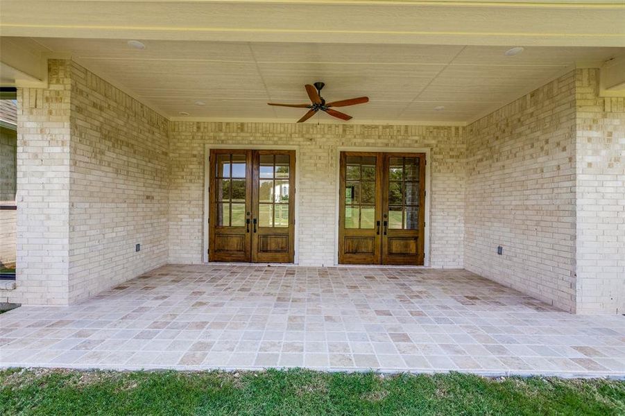 View of patio / terrace featuring french doors and ceiling fan