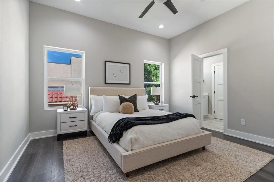 Bedroom featuring dark wood-type flooring and ceiling fan