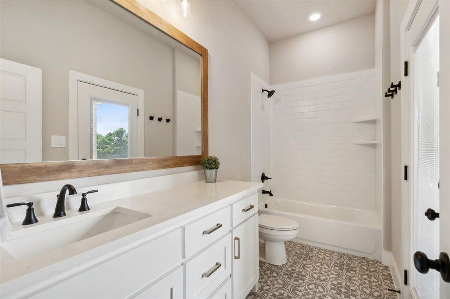 Bathroom 3 with access to the back patio - perfect for as a future pool bath or guests!