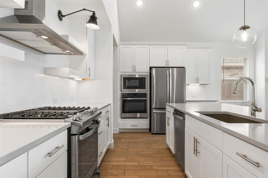 Another view of kitchen work area. Lots of storage and cute shelving for all your favorite kitchen items.