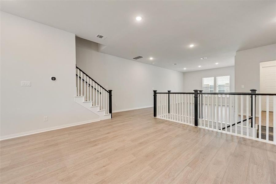 Spare room featuring light hardwood / wood-style flooring