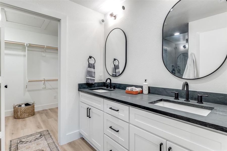 Bathroom with vanity and hardwood / wood-style floors