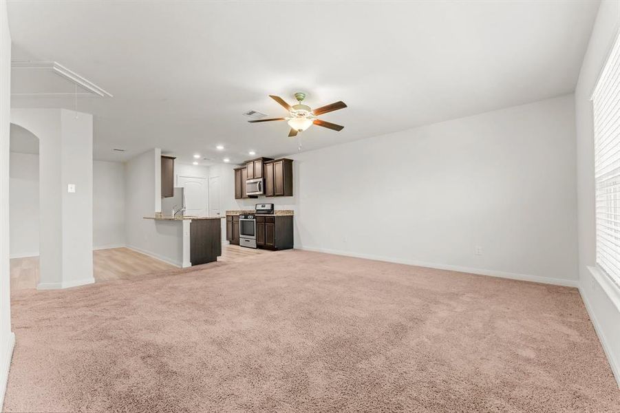 A great view of this room's elegance looking toward the Kitchen and Dining area. This floor plan is great for entertaining or casual family living.