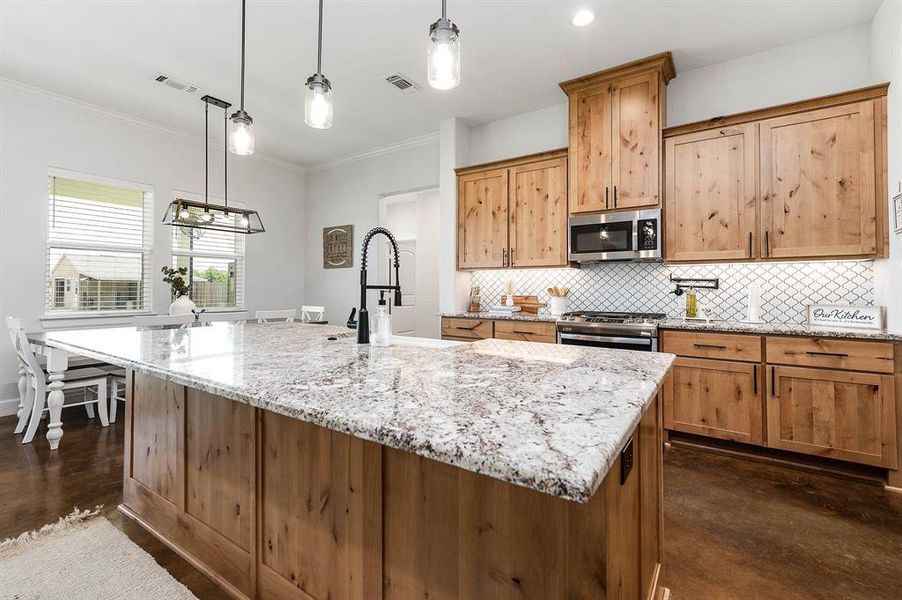 Large island separates the kitchen and living areas