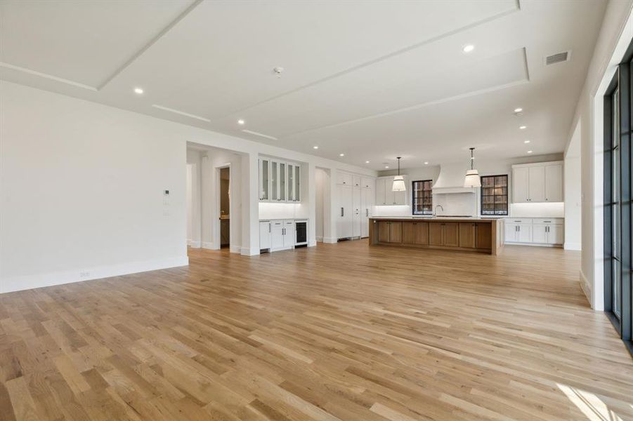 Living room featuring sink and light hardwood / wood-style floors