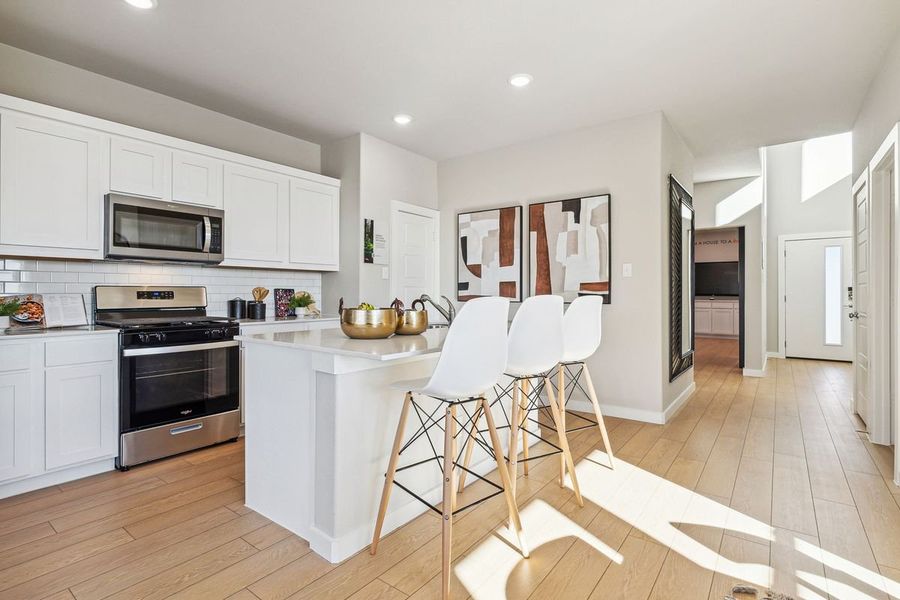 Kitchen in the Willow home plan by Trophy Signature Homes