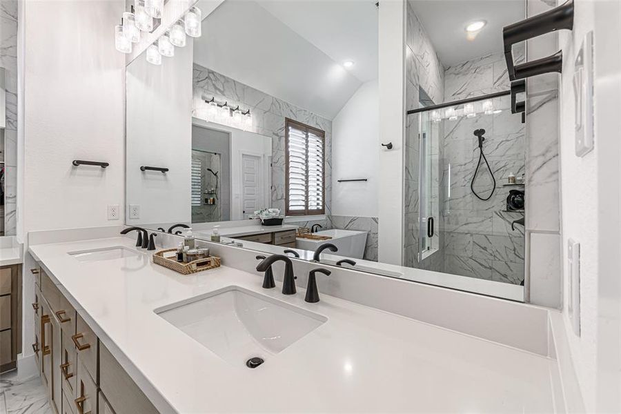 Double sinks and sleek quartz countertops.