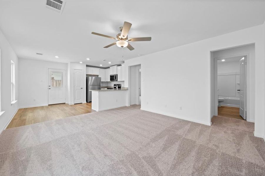 The kitchen overlooks the living room and dining area so that you never miss a beat as you prep your next meal.