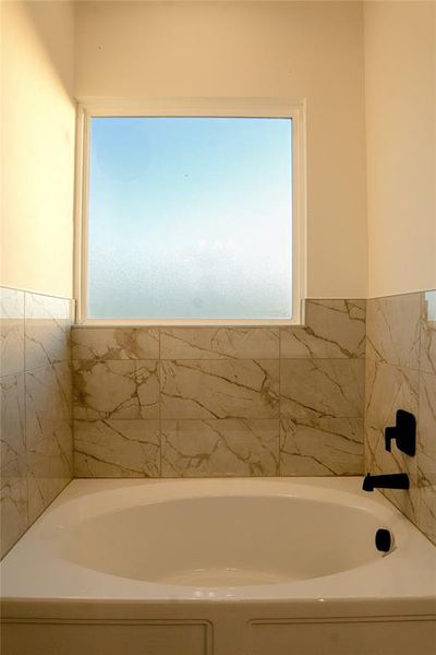 Bathroom featuring a washtub