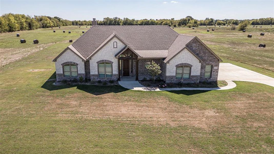 French provincial home with a rural view and a front yard