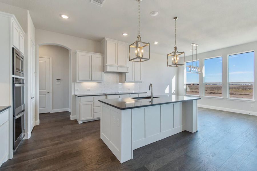 Kitchen & Nook | Concept 2406 at Hidden Creek Estates in Van Alstyne, TX by Landsea Homes