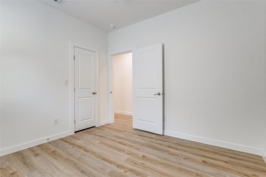 Unfurnished room with light hardwood / wood-style floors