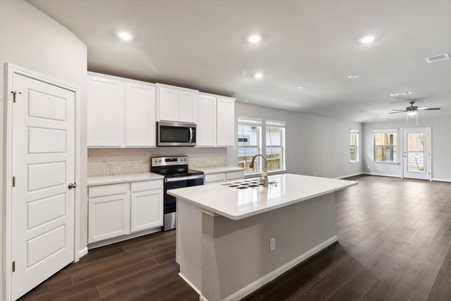 Kitchen in the Hughes floorplan at a Meritage Homes community.