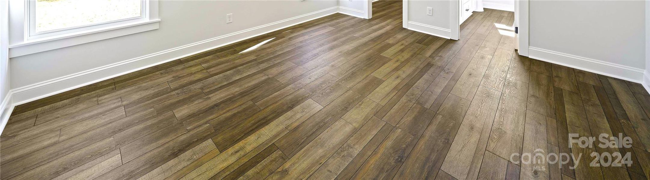 Stunning vinyl plank floors throughout. (No carpet.)