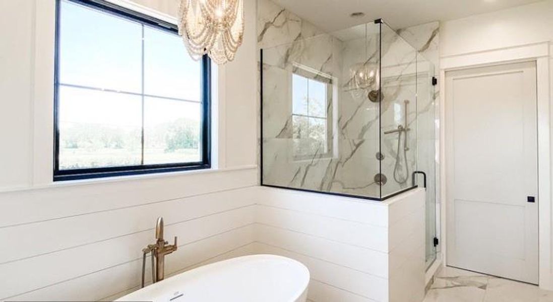 Bathroom featuring independent shower and bath