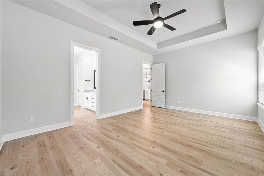 Master bedroom is downstairs with stunning vinyl flooring.
