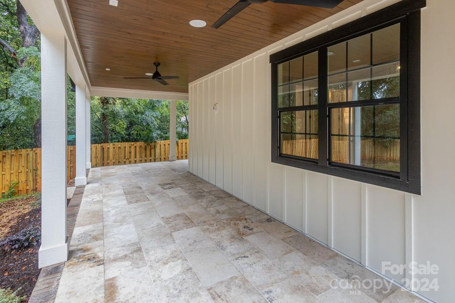 Large covered porch overlooking the backyard