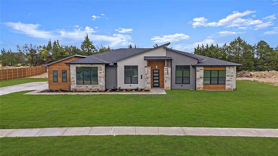 View of front of home with a front yard