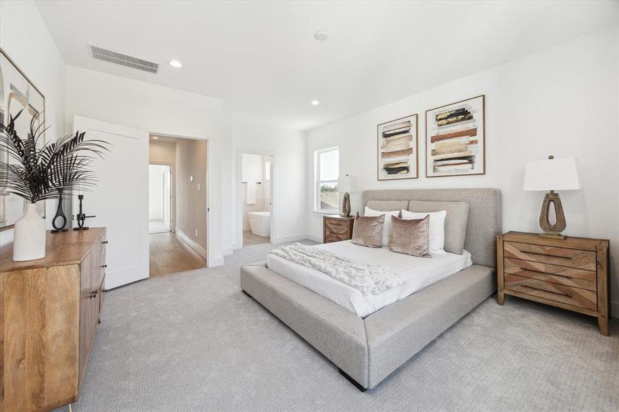 Porcelain floor tiles and glossy white subway tiles exudes luxury. Windows above the soaking tub offers natural light while maintaining privacy.