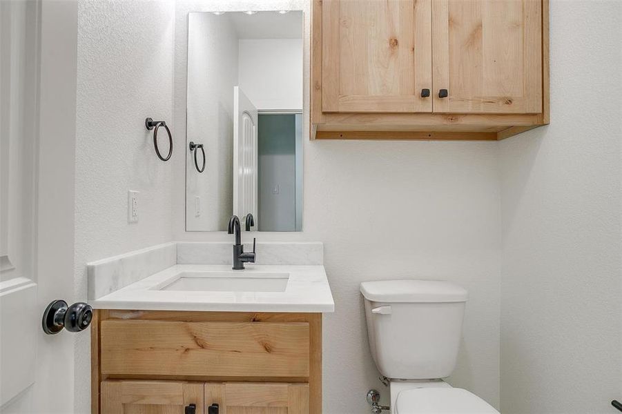 Bathroom featuring toilet and vanity