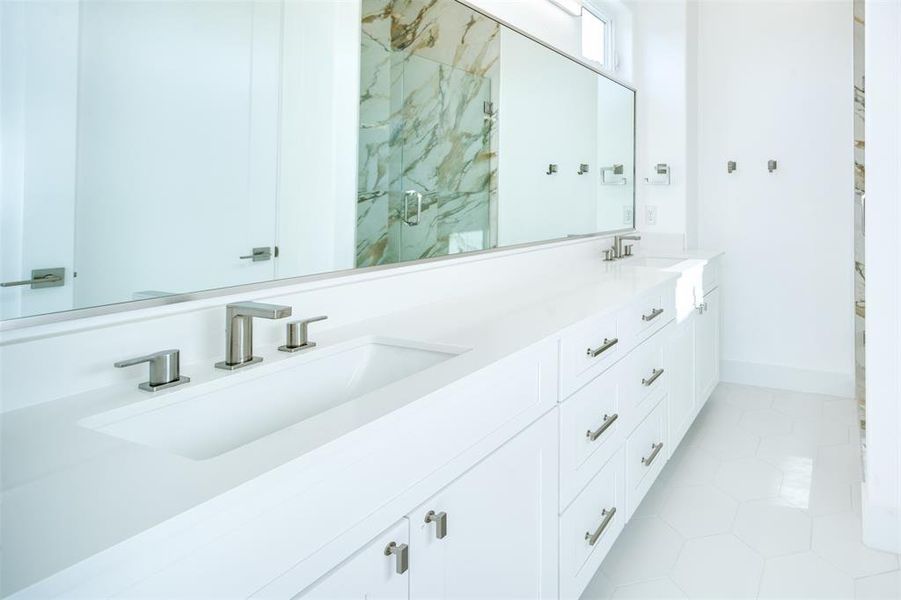 Bathroom with a shower with door, vanity, and tile patterned flooring