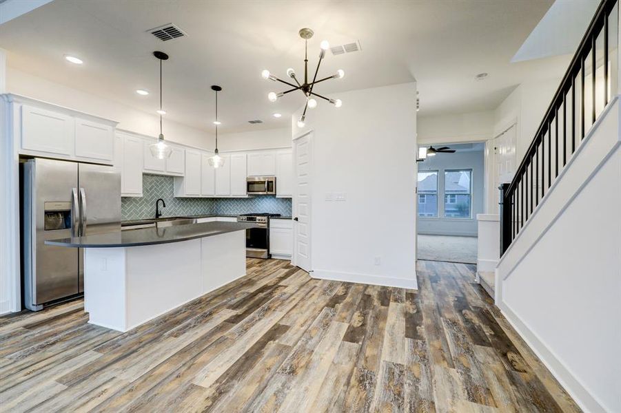 Quartz stone island kitchen w subway tile