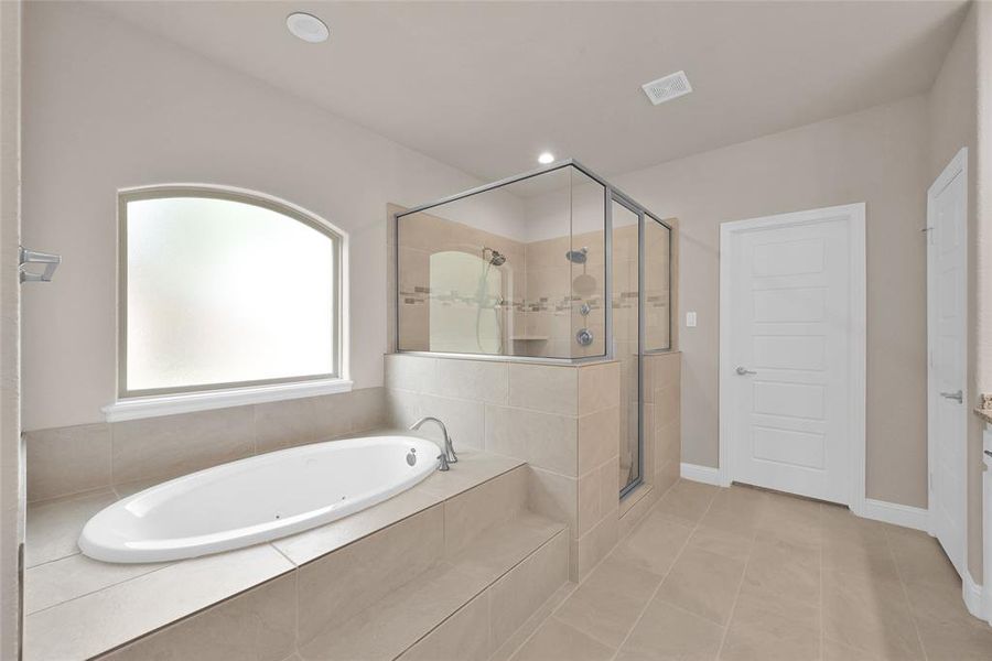 Large en-suite primary bathroom! Privacy glass, and huge shower!