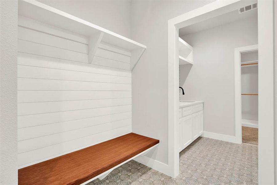 Mudroom coat bench with shiplap