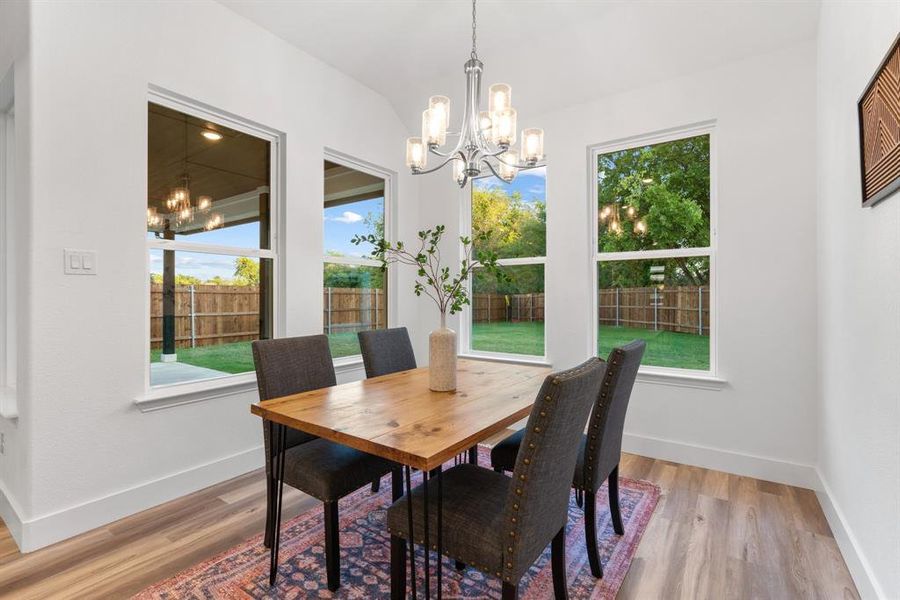 Dining area featuring a chandelier and hardwood / wood-style floors