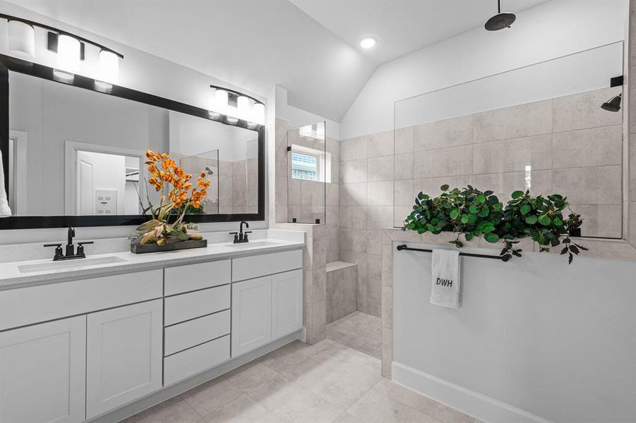 EXAMPLE PHOTO:  Spacious Master bath with big walk in shower with rain shower head and bench.  Drawer stack between sinks too!