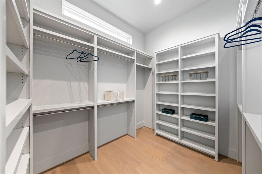 Dual walk-in closets create options in the primary suite.