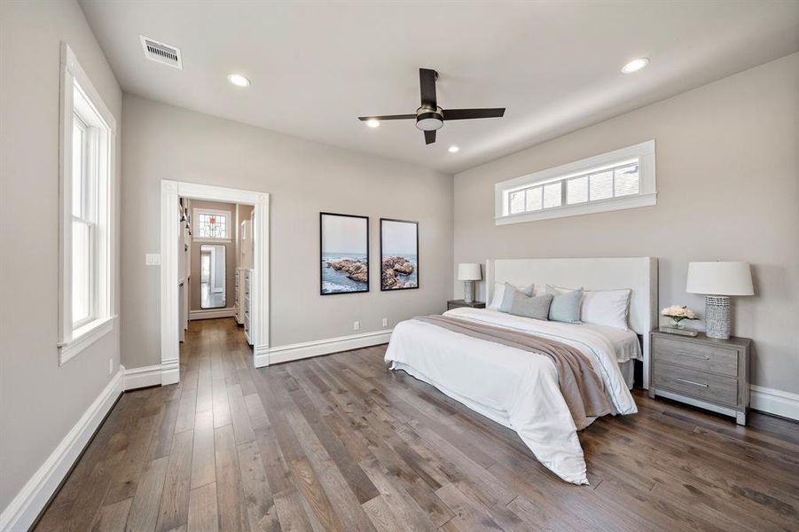 Upstairs primary bedroom. Staged with a king bed and still room for a seating area or end of bed bench!