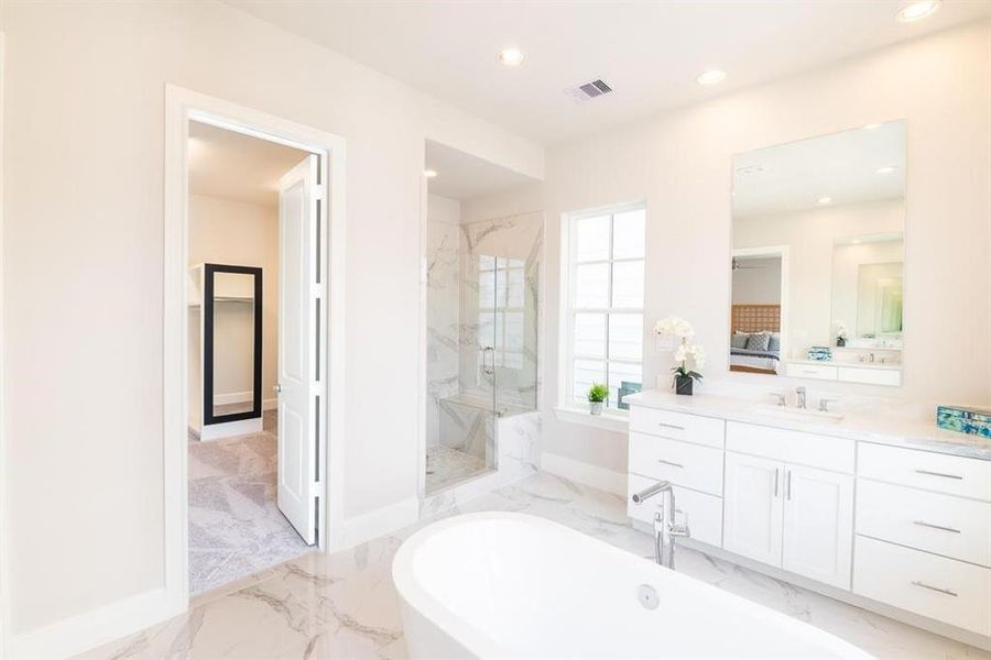 Luxury with this gorgeous shower with bench seat and frameless shower door. Closet is like a whole room in itself with a mirror and pull down racks