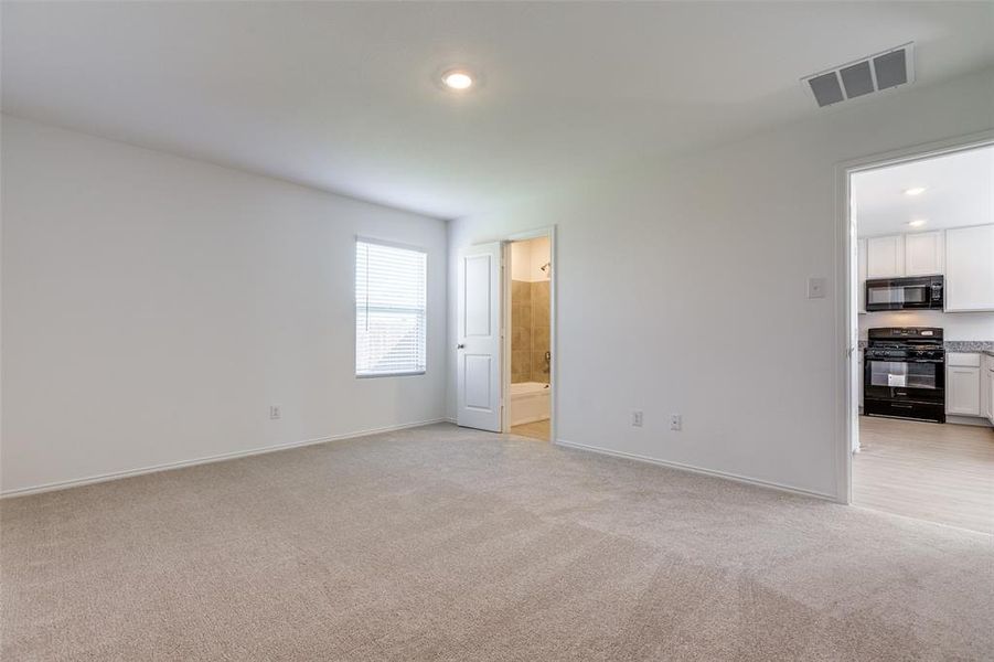 Unfurnished room with light colored carpet