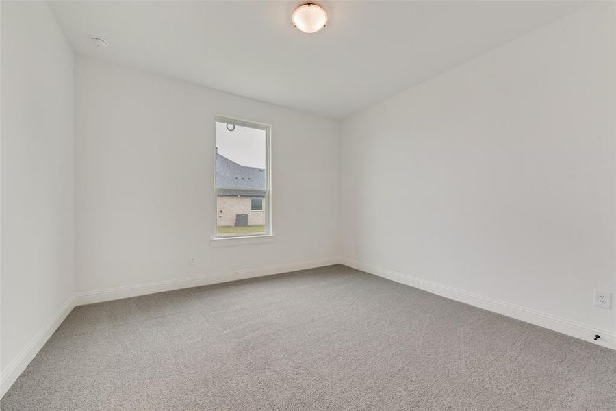 Unfurnished room with carpet flooring