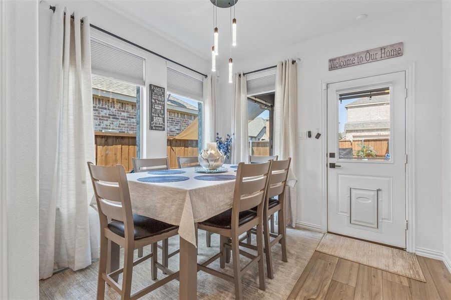 Dining room with light hardwood / wood-style floors