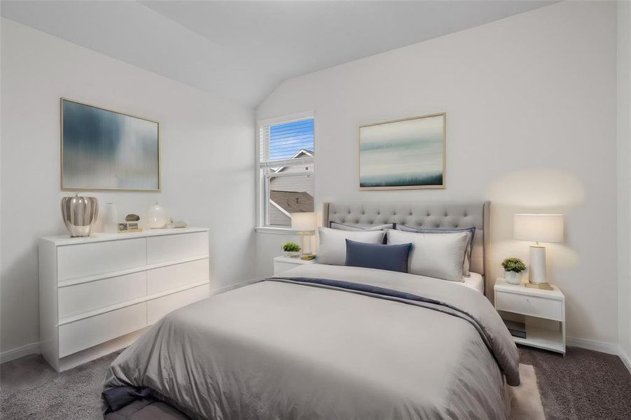 Rest easy in this beautifully staged bedroom, where comfort meets style. The soft, neutral palette and large window create a serene environment, while the carefully selected furnishings highlight the room’s potential as a cozy retreat. **This image is from another Saratoga Home with similar floor plan and finishes, not the Brayden floorplan.**