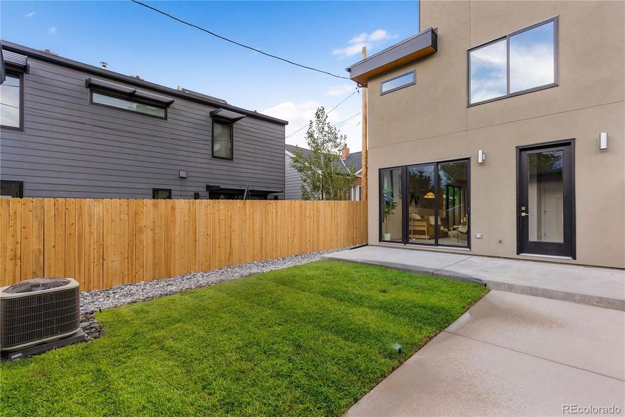 Fresh sod and landscaping round out the back yard of this stunning home.