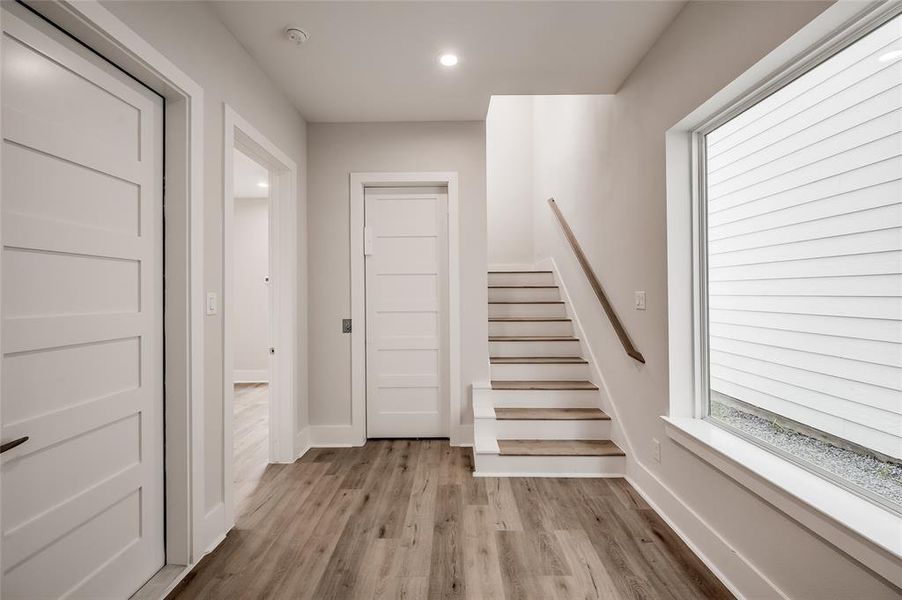 The entry foyer has access to the garage, downstairs ensuite bedroom and the elevator.