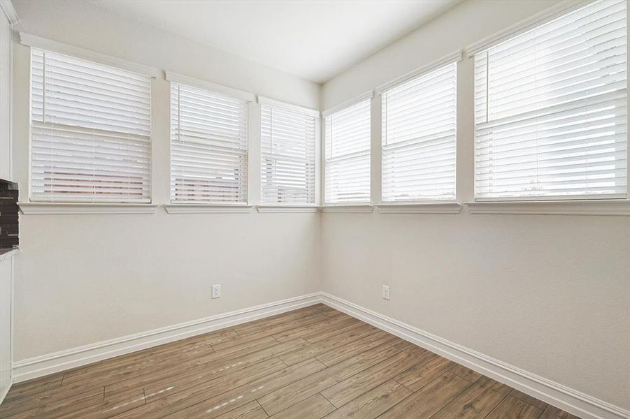 Unfurnished room featuring hardwood / wood-style floors