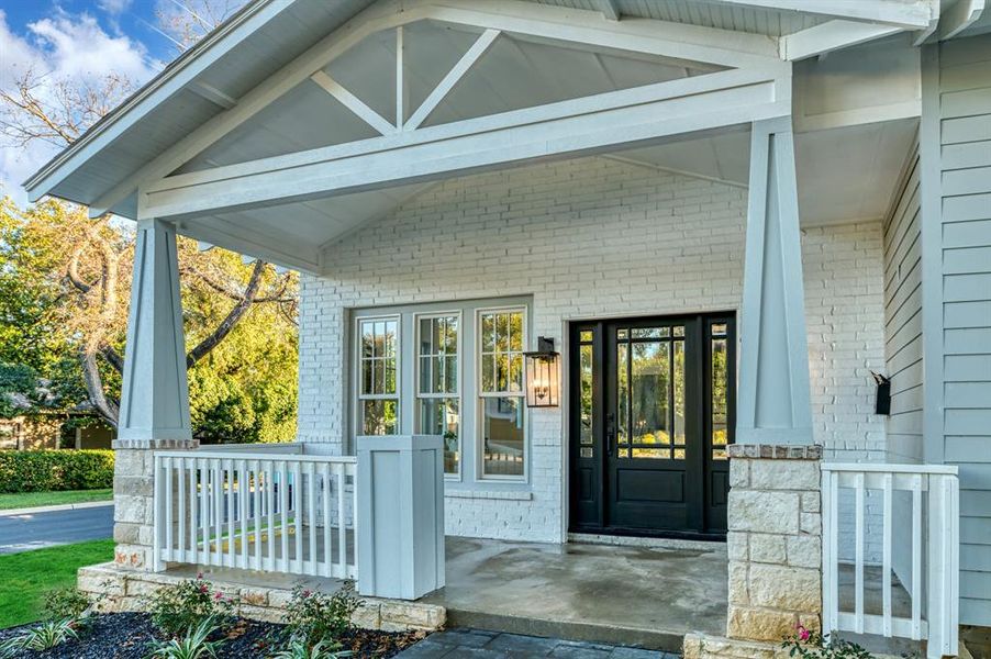 Entrance to property featuring a porch