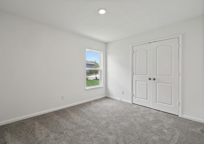 Guest bedroom with a double door closet