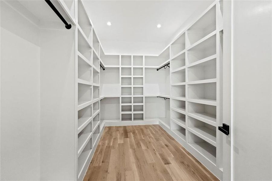 Walk in closet featuring hardwood / wood-style floors