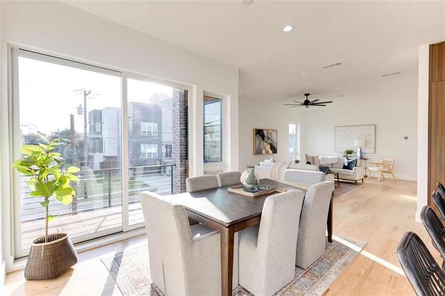 Dining room featuring ceiling fan and light hardwood / wood-style flooring