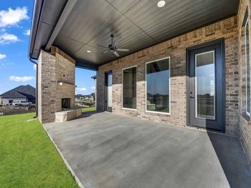 View of patio featuring ceiling fan