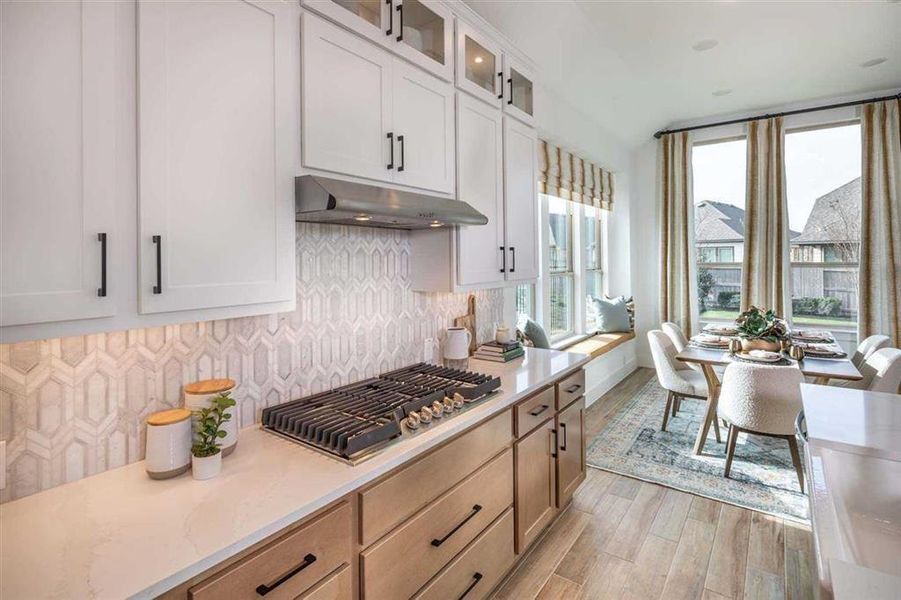 Imagine cooking in this gorgeous kitchen with the windows open so your neighbors know they’re living next door to a chef!